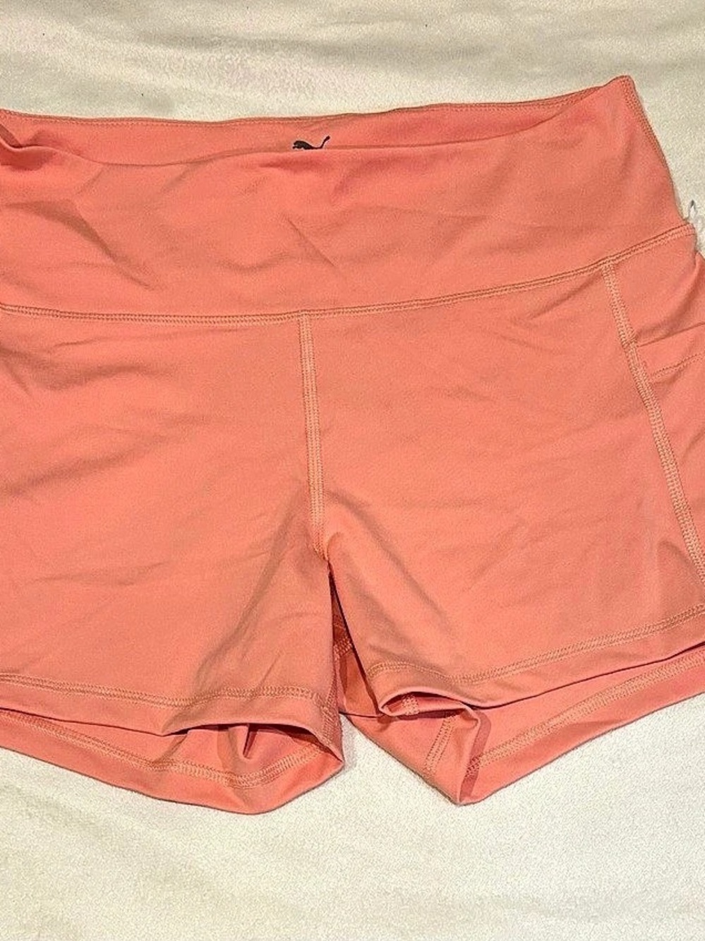 Puma high-waisted athletic shorts in orange size large